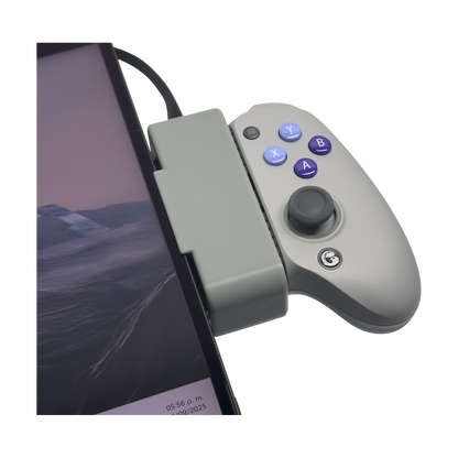 White Gamesir G8 in the holder at the tablet corner, close-up